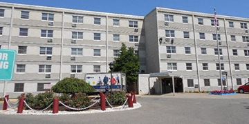 Lorain apartment for rent - a large building with a truck parked in front of it