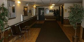Elyria apartment for rent - the lobby of a building with chairs and a rug