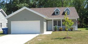 Lorain apartment for rent - a white garage door in front of a house