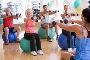 Anaheim apartment for rent - a group of people doing a yoga class with dumbbells