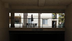 Anaheim apartment for rent - a balcony with a table and chairs in a building