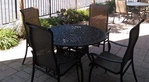 Norwalk apartment for rent - a table and chairs on a patio