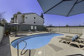 Lynnwood apartment for rent - Resort Style Pool with Lounge Chairs in the Sun at Campo Basso Apartment Homes, WA 98087