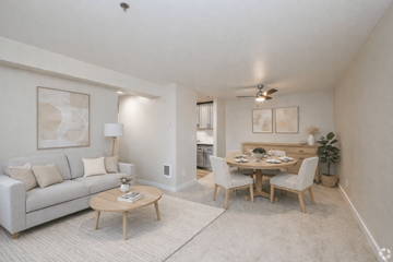 Everett apartment for rent - A living room with a couch, a coffee table, and a dining table with chairs.