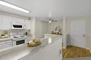 Lynnwood apartment for rent - A kitchen with white cabinets and a marble countertop.