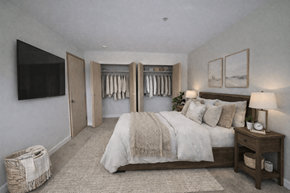 Seattle apartment for rent - A bedroom with a large bed and a TV on the wall.