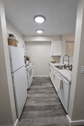 Seattle apartment for rent - A kitchen with white appliances and a white refrigerator.
