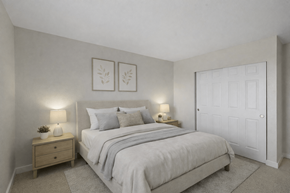 Lynnwood apartment for rent - A bedroom with a bed, nightstand, and two wall lamps.