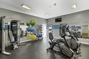 Everett apartment for rent - a gym with cardio equipment and weights  at Camelot Apartment Homes, Everett, WA, 98204