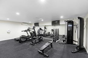Everett apartment for rent - a gym with cardio equipment and a flat screen tv  at Casa Blanca Apartment Homes, Washington, 98204