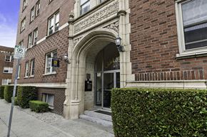 Seattle apartment for rent - a brick building with an arched doorway  at Charbern Apartment Homes, Seattle, WA, 98122