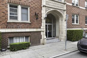 Seattle apartment for rent - an antique-style building with a door and a car parked in front of it  at Charbern Apartment Homes, Seattle, Washington