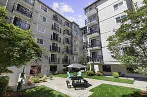 Seattle apartment for rent - Resident Courtyard patio with a table and chairs at King Arthurs Court, Washington