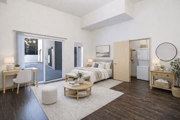 Seattle apartment for rent - A modern bedroom with a white bed and a wooden floor.