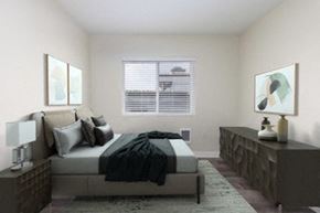 Seattle apartment for rent - a bedroom with a bed and a dresser and a window at Illumina Apartment Homes, Seattle