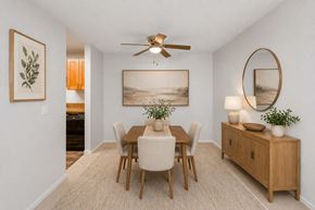 Edmonds apartment for rent - A dining room with a wooden table and chairs.