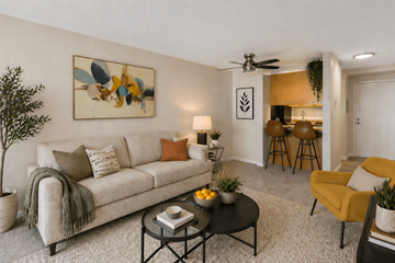 Edmonds apartment for rent - A living room with a couch, a chair, a table, and a painting on the wall.
