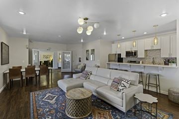 Lynnwood apartment for rent - A living room with a white couch and a rug.