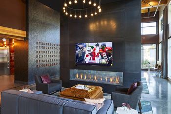 Lounge with fireplace & big screens