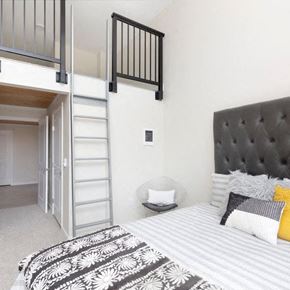Seattle apartment for rent - a bedroom with a bed and a lofted bed