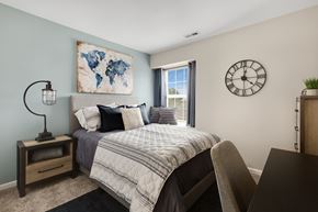 Rochester Hills apartment for rent - a bedroom with a large bed and a large window  at Northridge, Rochester Hills