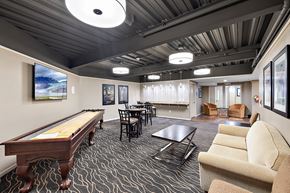 Northville apartment for rent - A room with a pool table and a couch at MainCentre, Northville