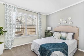 Canton apartment for rent - A bedroom with a large bed and a window with curtains at Park West, Canton, 48187