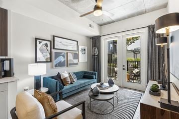 Durham townhouse for rent - A living room with a blue couch and a coffee table.