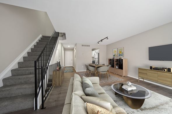 Novi apartment for rent - A living room with a grey couch and a coffee table.