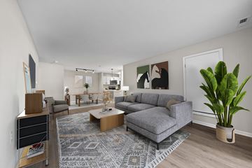 Canton apartment for rent - A living room with a grey couch and a coffee table.