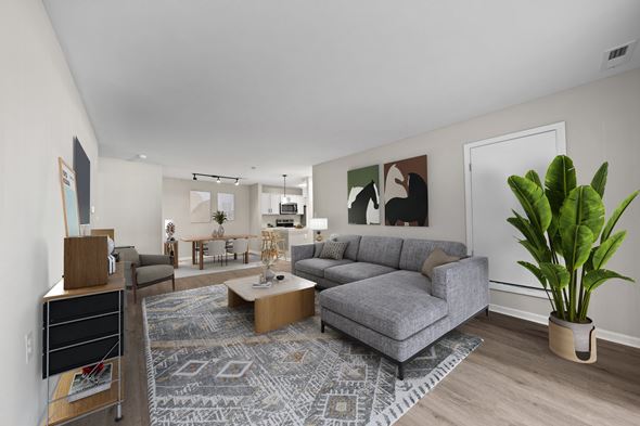 Canton apartment for rent - A living room with a grey couch and a coffee table.