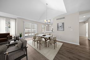 Canton apartment for rent - A modern dining room with a glass table and chairs.