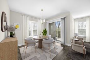 West Bloomfield apartment for rent - A modern dining room with a round table and chairs at Amberly Apartments, West Bloomfield, 48322