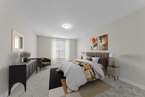 West Bloomfield apartment for rent - A bedroom with a large bed and a dresser at Amberly Apartments, West Bloomfield, 48322