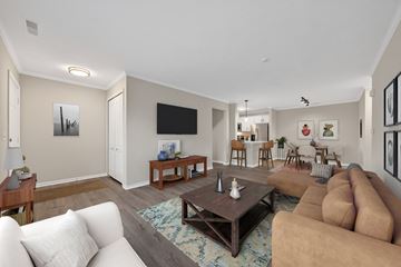 Canton apartment for rent - A living room with a white couch and a brown couch.