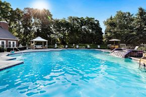 Commerce Township apartment for rent - A large swimming pool with a gazebo in the background at Briarcliff Village, Michigan, 48390