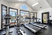 Spring Lake apartment for rent - A gym with treadmills, elliptical machines, and stationary bikes. at Village on the Lake Apartments, Spring Lake, NC, 28390