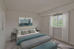 Herndon apartment for rent - A bedroom with a large bed and a painting on the wall at Dulles Glen Apartments, Virginia, 20170