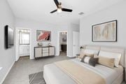 Orlando apartment for rent - a bedroom with a large bed and a ceiling fan at Northlake Park, Florida, 32827