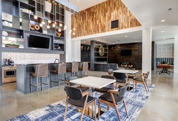 Fuquay-Varina apartment for rent - A modern kitchen with a dining area and a bar.