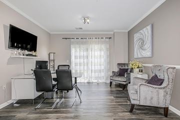 Manassas apartment for rent - a living room and dining room with a table and chairs