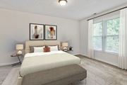 Fayetteville apartment for rent - a bedroom with a bed and a window 
