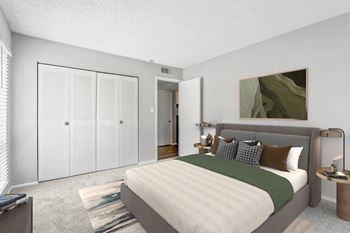 A bedroom with a bed and a closet