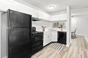 Greensboro apartment for rent - Open Kitchen with Black Appliances at Lakes Edge Apartments, Apartments, Greensboro, NC