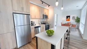 Herndon apartment for rent - a kitchen with stainless steel appliances and a white counter top at Makers Rise, Herndon Virginia