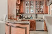 Springfield apartment for rent - A kitchen with wooden cabinets and a granite counter.
