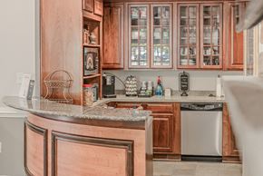 Springfield apartment for rent - A kitchen with wooden cabinets and a granite counter.
