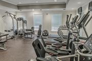 Springfield apartment for rent - A gym with a variety of equipment including treadmills, weights, and exercise machines.