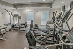 Springfield apartment for rent - A gym with a variety of equipment including treadmills, weights, and exercise machines.