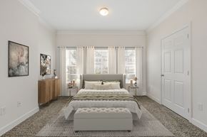 Spring Lake apartment for rent - a bedroom with a bed and a large window at Stone Gate Apartments in NC  at Stone Gate Apartments, North Carolina